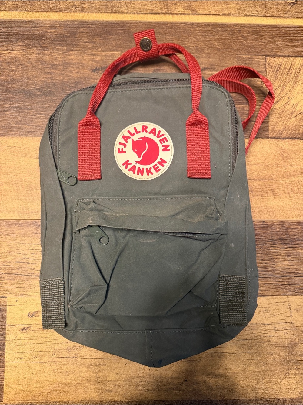 Fjallraven Kanken Backpack in Dark Green with Red Accents
